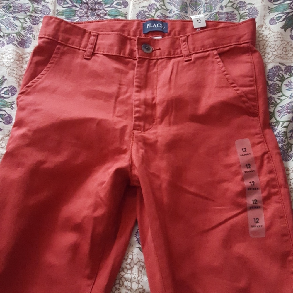 Boys Red zippered pants.